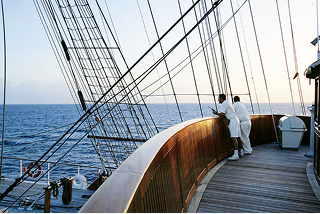 Crew on deck of SEA CLOUD II, rigging and open Atlantic